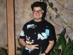 Dabboo Ratnani smiles as he poses for paps