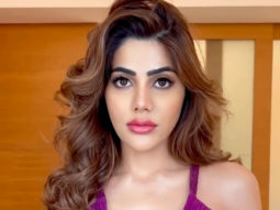 Nikki Tamboli looks dazzling in a purple outfit