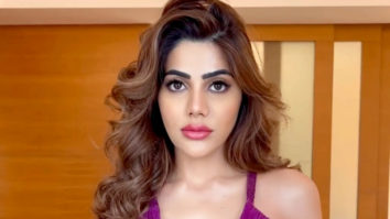 Nikki Tamboli looks dazzling in a purple outfit