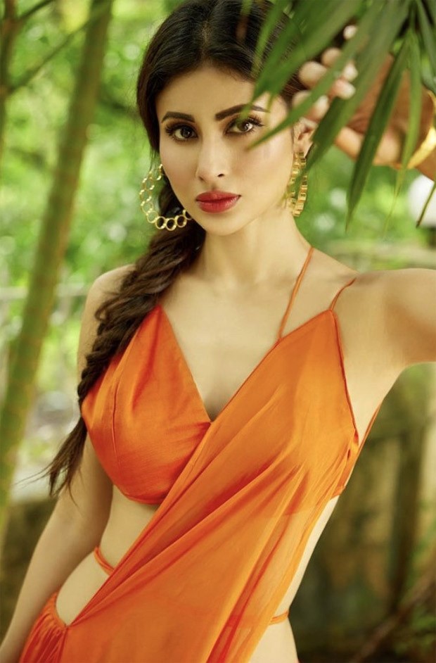 Mouni Roy looks bold & bright in an orange slip ensemble as she poses for her latest photo-shoot