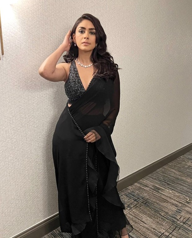 Mrunal Thakur looks like a bombshell in black saree and sequined black and silver blouse Mrunal Thakur looks like a bombshell in black saree and sequined black and silver blouse