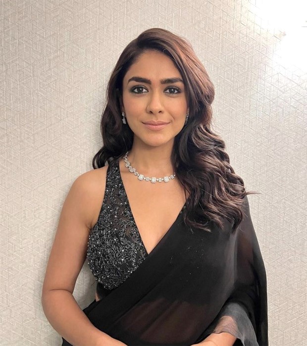 Mrunal Thakur looks like a bombshell in black saree and sequined black and silver blouse Mrunal Thakur looks like a bombshell in black saree and sequined black and silver blouse