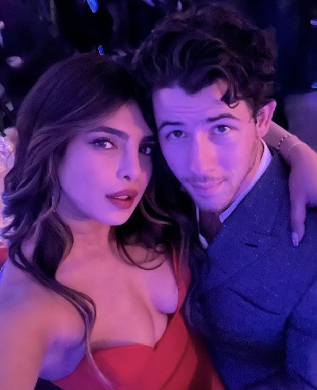 Priyanka Chopra sets the temperature soaring in a risque red gown at a wedding she attended with husband Nick Jonas 