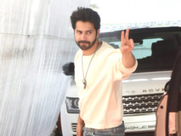 Varun Dhawan poses for paps in white sweatshirt and denims