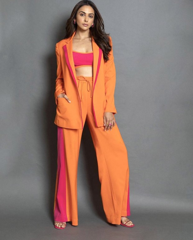 Rakul Preet Singh give notes on how to master colour blocking this season in an Orange and pink pantsuit worth Rs. 18,000!