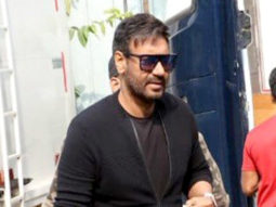 Ajay Devgn waves at paps in a black tshirt