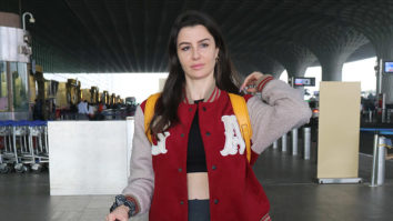 Giorgia Andriani poses for paps in a red jacket