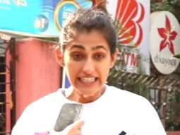 Kubbra Sait cheerfully waves at paps outside gym