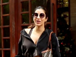 Sophie Choudry plays with a cute doggo as she poses with paps
