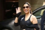 Sophie Choudry poses for paps outside gym