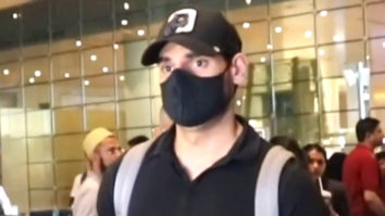 Ahan Shetty gets clicked at the airport in a simple black tshirt and cap