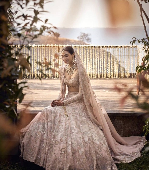 Athiya Shetty makes a vivacious bride in a blush pink lehenga by Anamika Khanna with radiant rose gold makeup