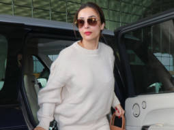 Malaika Arora slays an all white airport look as she gets clicked