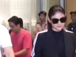 Mouni Roy wishes paps Happy new year as she walks hand in hand with husband