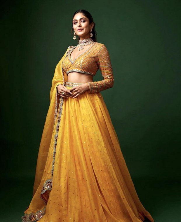 Mrunal Thakur conveys her fans wishes for Pongal and Makar Sankranti with a series of photographs wearing a yellow silk organza lehenga
