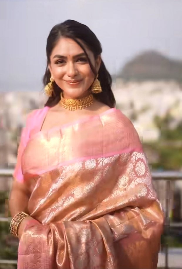 Mrunal Thakur, dressed in a blush pink brocade saree and with gajra in her hair, has our whole attention