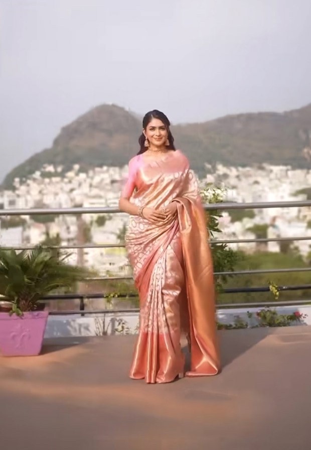 Mrunal Thakur, dressed in a blush pink brocade saree and with gajra in her hair, has our whole attention