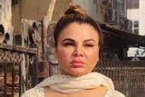 Rakhi Sawant gets clicked in white salwar paired with golden handbag