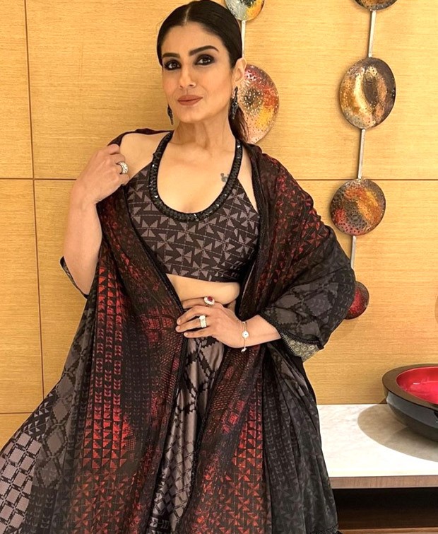 Raveena Tandon in a beautiful black and red lehenga by Manish Malhotra embodies ethnic fashion at its finest