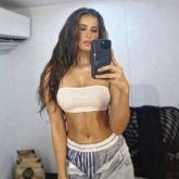 Tara Sutaria wears a white tube top with unbuttoned jeans in the most dramatic way