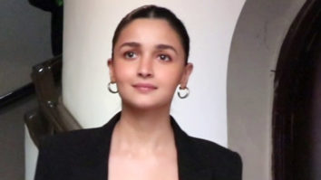 Alia Bhatt poses with a little kid flaunting her merch