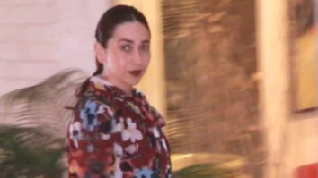 Karisma Kapoor cheerfully waves at paps dressed in a flowy outfit