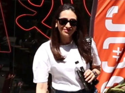 Karisma Kapoor poses for paps rocking a pair of jeans & white top