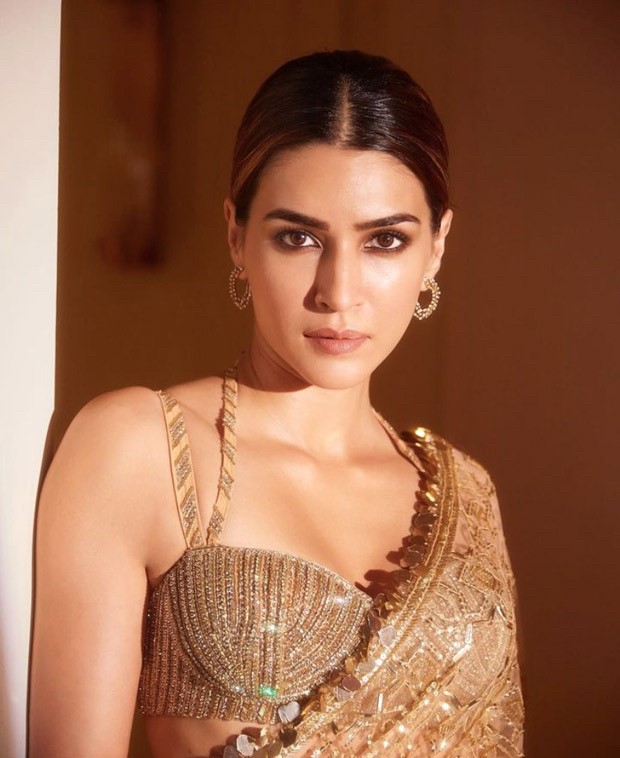 Kriti Sanon turns into the ultimate golden girl at Sidharth and Kiara's wedding reception wearing a golden sheer saree by Manish Malhotra