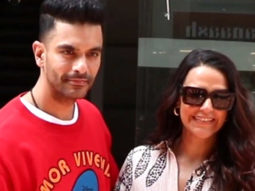 Neha Dhupia and Angad Bedi pose together for paps as they get clicked in the city