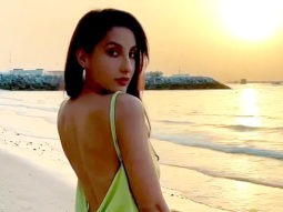 Nora Fatehi kills it with her perfect curves and a beautiful green satin dress