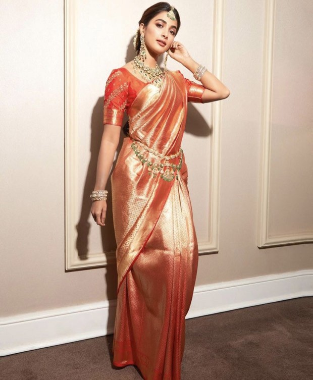 Pooja Hegde embraced an orange kanjivaram saree for a contemporary south Indian look at her brother's wedding