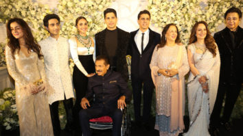 Sidharth and Kiara pose for a family photo at their reception