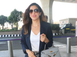 Sophie Choudry flashes a wide smile for paps at the airport