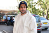 Sunny Singh Nijjar slays the casual airport look as he poses for paps in a white hoodie