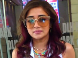 Tina Dutta pairs up her all white look with funky glasses as she poses for paps