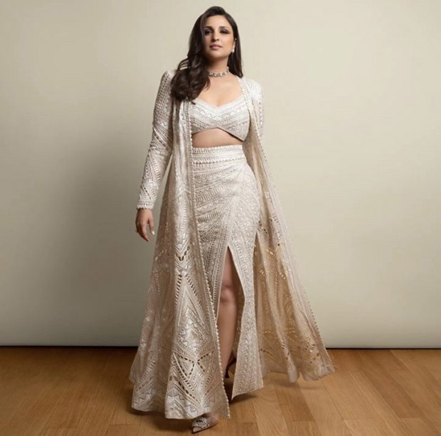 Parineeti Chopra in Ritika Mirchandani outfit effortlessly walked the ramp in an embroidered crop top, thigh high slit skirt and a full -sleeved half jacket