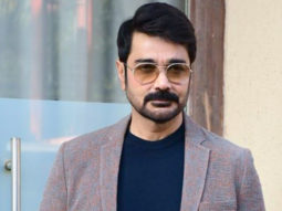 Prosenjit Chatterji poses for paps with a coffee mug