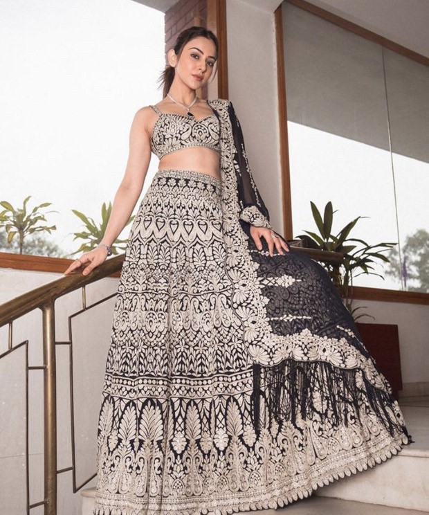 We can't hold still looking at Rakul Preet Singh in an embroidered navy lehenga by Seema Gujral 