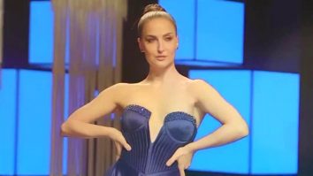 Elli AvrRam slays the runway in this glittery blue gown