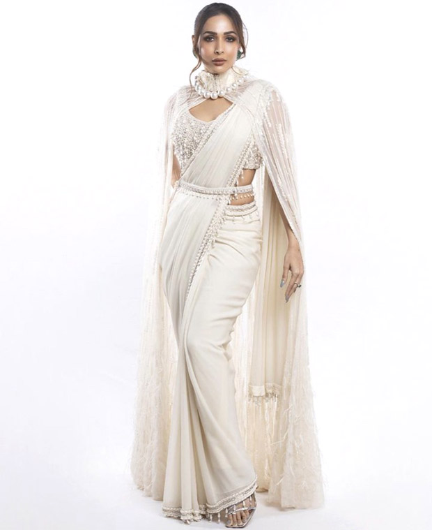 Malaika Arora adds a contemporary twist to her ethnic style quotient with a stunning cape saree embellished with pearls