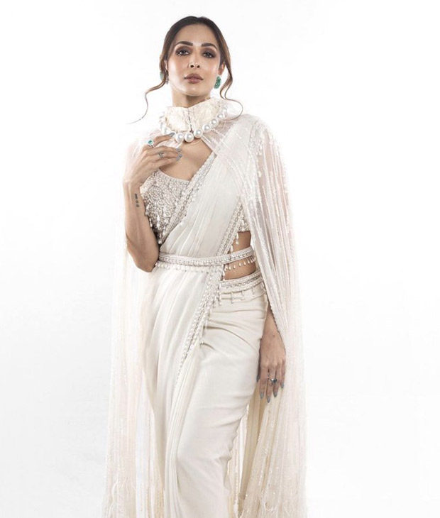 Malaika Arora adds a contemporary twist to her ethnic style quotient with a stunning cape saree embellished with pearls