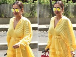 Malaika Arora looks fun and fabulous in a yellow pleated mini dress with a pink Valentino handbag