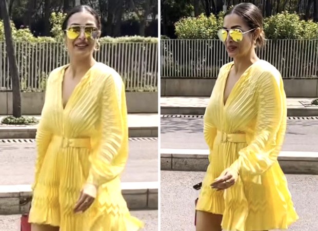 Malaika Arora looks fun and fabulous in a yellow pleated minidress with a pink Valentino handbag : Bollywood News