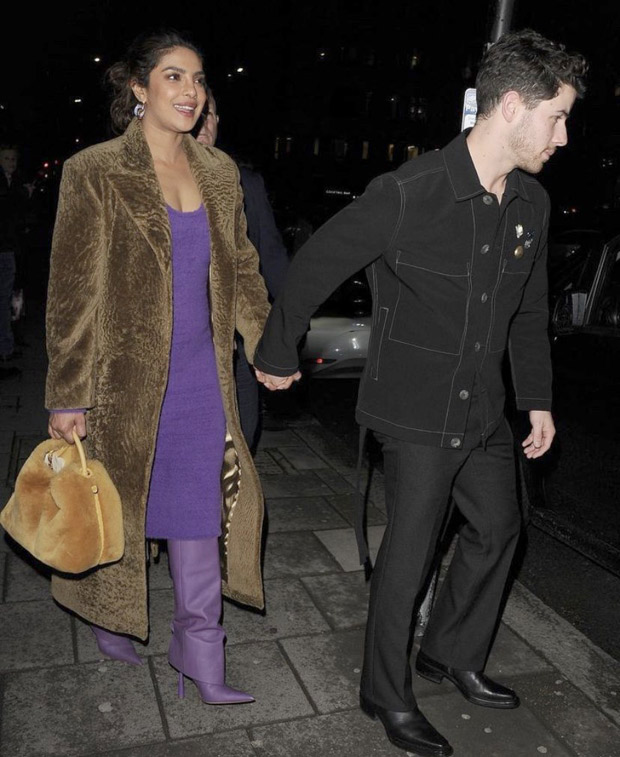 Priyanka Chopra keeps London aesthetic in check for dinner with Nick Jonas and Jonas Brothers as she dons a purple dress, furry overcoat, pantaboots and cutesy bag
