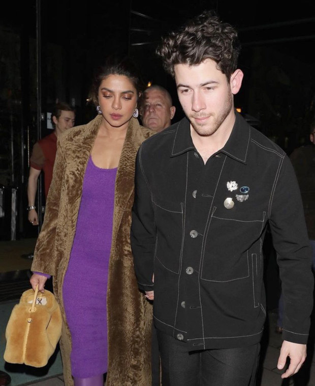 Priyanka Chopra keeps London aesthetic in check for dinner with Nick Jonas and Jonas Brothers as she dons a purple dress, furry overcoat, pantaboots and cutesy bag