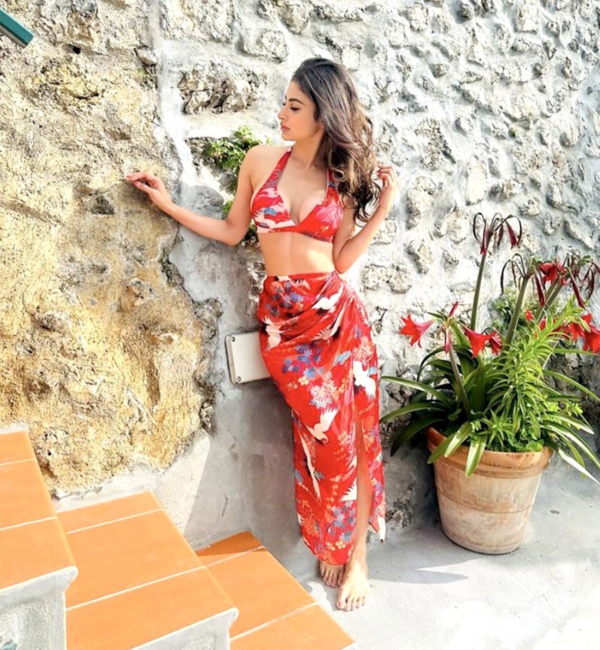 Mouni Roy blooms in her mesmerizing red sarong and bikini, adding a touch of paradise to her vacation style