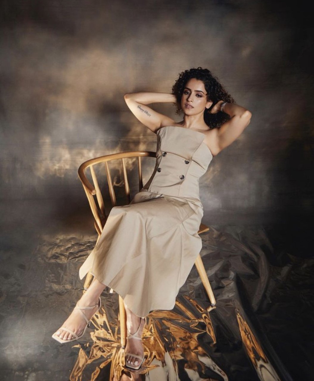 Sanya Malhotra exudes effortless elegance in a beige strapless dress with delicate button details