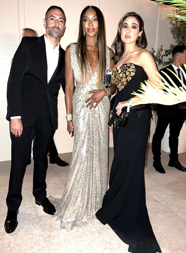 Sara Ali Khan smiles for the camera with Naomi Campbell in a heart-patterned Moschino dress and heart-shaped purse at Cannes 2023