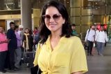 Sunny Leone’s airport fashion is on point with yellow crop shirt