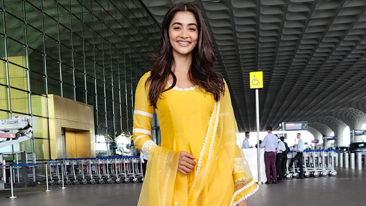 Pooja Hegde looks pretty in a bright yellow salwar at the airport | Images - Bollywood Hungama